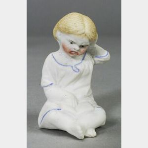 Seven Molded Seated All Bisque Dolls