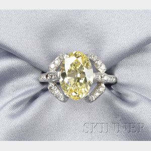 Platinum and Fancy Intense Yellow Diamond Solitaire