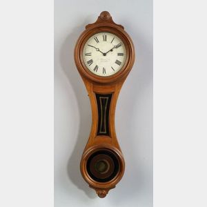 Walnut Figure-Eight Wall Timepiece