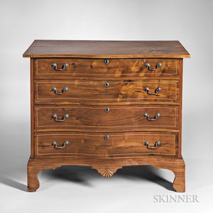 Carved and Inlaid Mahogany Reverse Serpentine Chest of Four Drawers