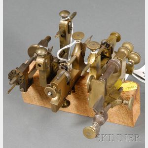 Four Brass and Steel Pivot Polishing Tools and a Small Turn