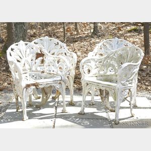 Four White-painted Cast Iron Lily of The Valley Pattern Garden Armchairs