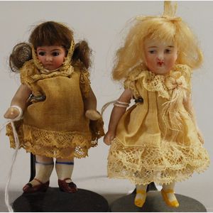 Two Miniature All-Bisque Dolls With Dome