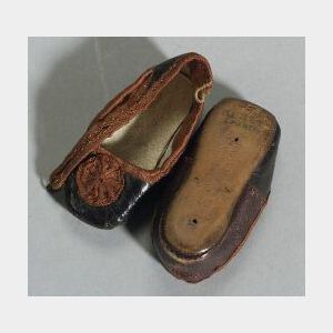 Huret Marked Shoes for a Girl Doll