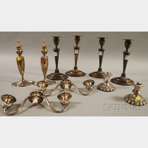 Four Pairs of Weighted Silver-plated Candlesticks