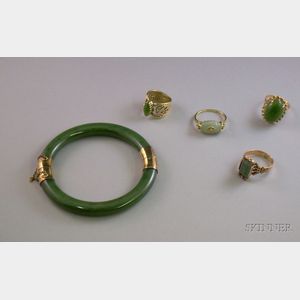 Four 14kt Gold Jade or Quartz Rings and a Jade and Gilt Silver Bangle