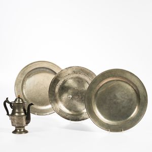 Three Pewter Chargers and a Pewter Coffeepot