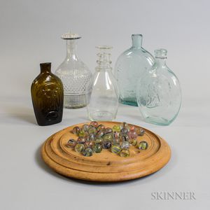 Five Glass Bottles and Flasks, a Set of Marbles, and a Game Board