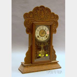E. Ingraham & Co. Pressed Oak Gingerbread Shelf Clock.