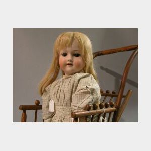 A.M. Bisque Head Doll in Wicker Carriage
