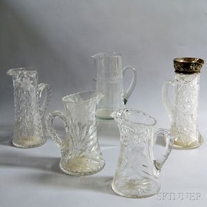 Five Etched and Cut Glass Pitchers