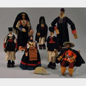 Seven Carved Wood and Paint-decorated Dolls