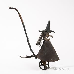 Carved Witch on a Bicycle Push Toy