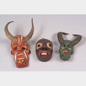 Three Polychrome Carved Wood Masks