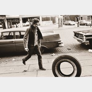 Jim Marshall (American, 1936-2010) Bob Dylan Kicking Tire, Seventh Avenue, New York City