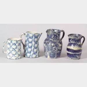 Four Blue and White Spongeware Pitchers