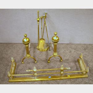 Brass Cast and Twist Fireplace Fender, a Pair of Ball-top Twist Andirons, and a Brass Stand with Three Tools.D...