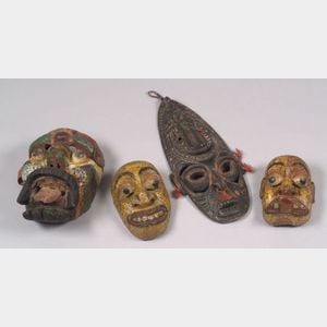Four Polychrome Carved Wood Masks
