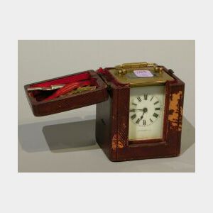 Leather Cased Diminutive French Brass Travel Clock.