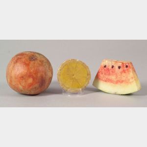 Three Pieces of Carved and Painted Stone Fruit