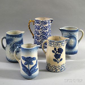 Five Blue and White Stoneware Pitchers