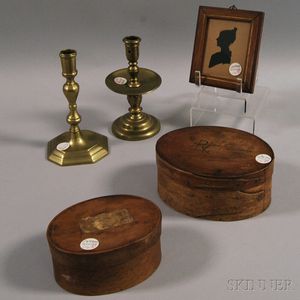 Two Small Covered Oval Boxes, Two Brass Candlesticks, and a Silhouette