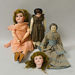 Three Bisque and Composition Dolls, a Bisque Doll Head, and a Trunk of Doll Clothing. 