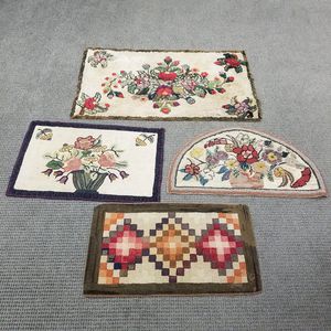 Three Floral Hooked Rugs and a Geometric Hooked Rug