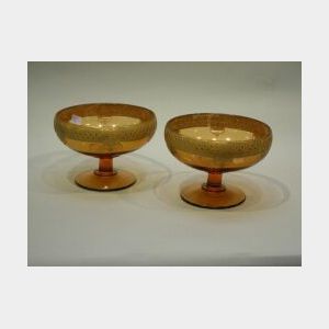 Pair of Continental Parcel-gilt Amber Glass Footed Bowls.