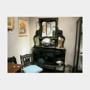 Late Victorian Ebonized Oak Etagere, late 19th century, with mirror inset shelved superstructure, the lower section fitted with a drawe