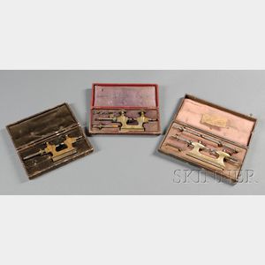 Three Boxed Sets of Cast Brass and Steel Jacot Tools