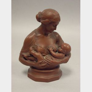 Patinated Cast Metal Bust of a Woman and Nursing Infant.