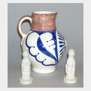 Three Wedgwood Items, comprising a Queen Victoria jug and two chess pieces.