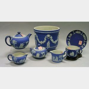 Wedgwood Dark Blue Jasper Dip Three-Piece Tea Set, Creamer, Jardiniere, Cup, and Saucer.
