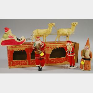Vintage Irwin Celluloid Santa Claus and Sleigh Figural Decoration and Three Vintage Santa Claus Cloth and Composition Figures.