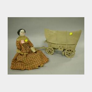 China Head Doll and a Wooden Covered Wagon Model.