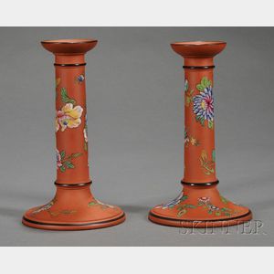 Pair of Wedgwood Enamel Decorated Rosso Antico Candlesticks