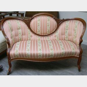 Victorian Upholstered Carved Walnut Settee.