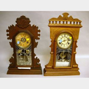 Waterbury Clock Co. Victorian Walnut Shelf Clock and an Ansonia Clock Co. Victorian Walnut Shelf Clock.