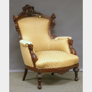 Victorian Renaissance Revival Upholstered Carved Walnut Parlor Armchair.