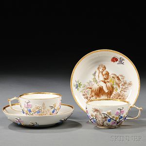 Two Meissen Molded and Hand-painted Porcelain Cups and Saucers