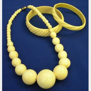 Carved Ivory Graduated Bead Necklace and Two Carved Bangle Bracelets.