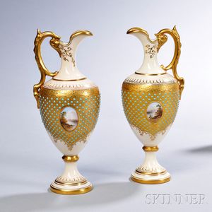 Two Similar Jeweled Coalport Porcelain Ewers