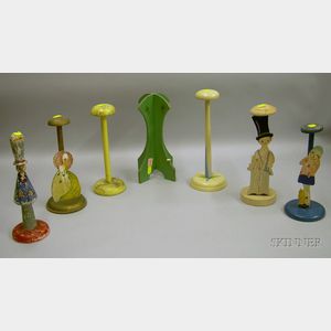 Seven Mostly Figural Paint Decorated Wooden Hat Stands.