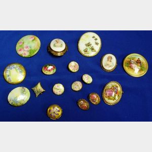 Fifteen Painted Porcelain Brooches and a Pair of Earrings.