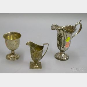Sterling Silver Footed Cup, Creamer, and a Silver Plated Jug.