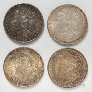 Three Common Date Morgan Dollars and a 1922 Peace Dollar. 