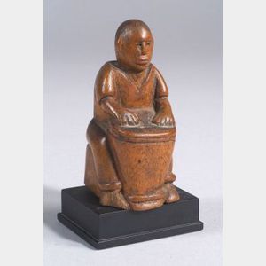 Carved Wooden Seated Figure with a Drum