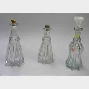 Three Pittsburg Colorless Ribbed Glass Decanters.