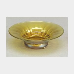 Nash Gold Iridescent Nut Dish, New York early 20th century, flared rim, shallow fluted body raised on circular foot, exterior with ligh